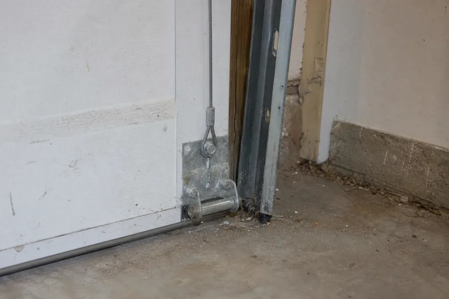 Bottom bracket, lift cable and roller on a garage door in Wichita, KS