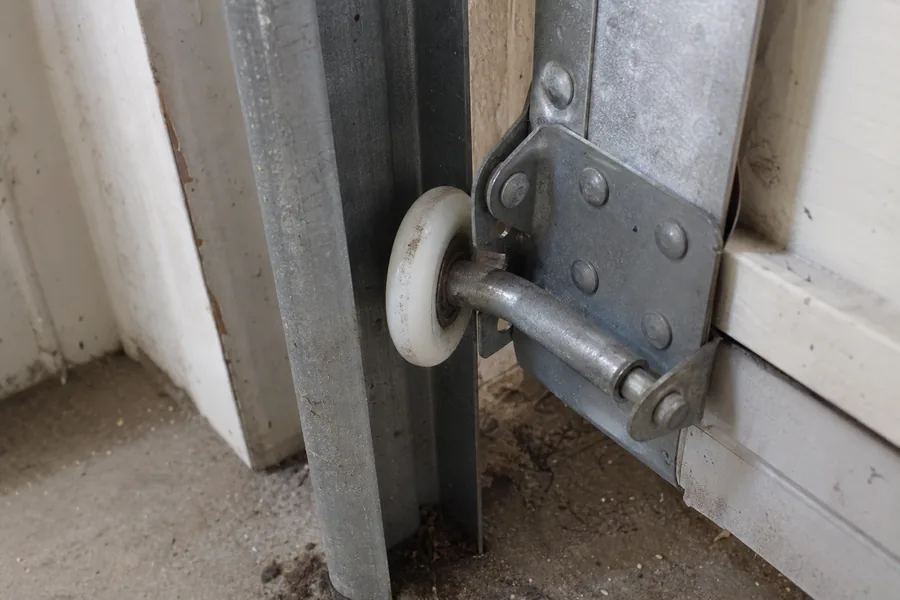 Garage door track with the safety eye bracket near the floor