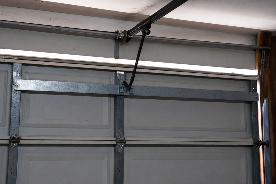 Reinforcement strut across the top panel of a double garage door in Wichita, KS